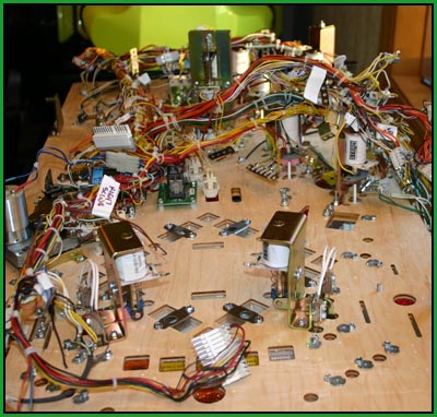 attaching a wiring harness to the pinball playfield